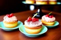 Appetizing cakes with cream and candied strawberries on it