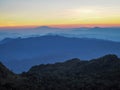 Beautifully graded twilight at Chiang Dao Mountain, the horizon line is orange. Many mountains are dark blue and light Royalty Free Stock Photo