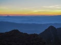 Beautifully graded twilight at Chiang Dao Mountain, the horizon line is orange. Many mountains are dark blue and light Royalty Free Stock Photo