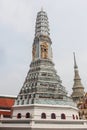 Beautifully intricate prang with golden details in Wat Phra Kaew temple. Bangkok, Thailand. Royalty Free Stock Photo