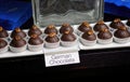 Beautifully lit dessert table with German chocolate cake cups toped with chocolate and pecans.