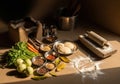 Rustic Indian Kitchen Scene with Fresh Vegetables, Spices, and Traditional Cooking Tools Royalty Free Stock Photo