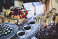 Beautifully luxury decorated catering banquet table with black and red caviar and different food snacks, on a party