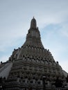 Beautifully painted white tower of the Buddhist temple Wat Arun in Bangkok Royalty Free Stock Photo