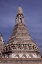 Beautifully painted white tower of the Buddhist temple Wat Arun in Bangkok Royalty Free Stock Photo