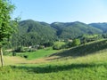 Beautifully panorama view with a turquoise blue sky, green mountains and vineyards Royalty Free Stock Photo