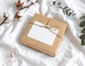 Gift Box with Blank Card on White Fabric Royalty Free Stock Photo