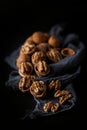 Beautifully presented walnuts on dark slate plate kitchen table