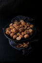 Beautifully presented walnuts on dark slate plate kitchen table