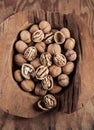 Beautifully presented walnuts on rusty wood table