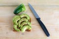 Beautifully rye toast bread with cut green avocado