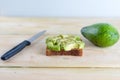 Beautifully rye toast bread with cut green avocado.