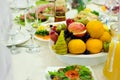 Beautifully served assorted fruits lie on a plate. Beautifully served table in the restaurant Royalty Free Stock Photo