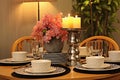 Beautifully served dining table set with elegant candleholder, dishes and flowers Royalty Free Stock Photo