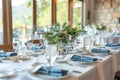 Beautifully Set Dining Table Ready for an Elegant Dinner Event at a Riverside Venue in Spring Royalty Free Stock Photo