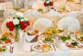 Beautifully set festive table, decorated with a bouquet of roses. The preparations for the party Royalty Free Stock Photo