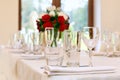 Beautifully set festive table, decorated with a bouquet of roses. The preparations for the party Royalty Free Stock Photo