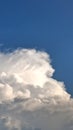 Beautifully shaped clouds in a bright blue sky Royalty Free Stock Photo
