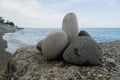 Beautifully stacked stones against the background of the sea Royalty Free Stock Photo