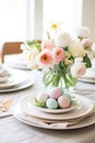 A beautifully styled Easter table setting with a floral centerpiece