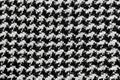 A beautifully woven tweed fabric texture background in a classic black-and-white houndstooth Royalty Free Stock Photo