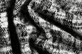 A beautifully woven tweed fabric texture background in a classic black-and-white houndstooth Royalty Free Stock Photo
