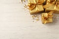 Beautifully wrapped gift boxes and confetti on white wooden table, flat lay. Space for text Royalty Free Stock Photo