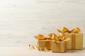 Beautifully wrapped gift boxes and confetti on white wooden table, space for text Royalty Free Stock Photo