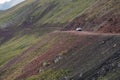 Beautifulview of green mountains with dangerous gravel road. Ketmen or Ketpen mountains gorge and mountain pass.