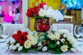 Beautifuly decorated wedding reception table covered with fresh flowers