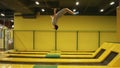 Beautifuly performed back somersault with the folowing full twisting double picked. Young athletic male enjoying jumping