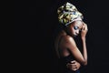 Shes an african queen. A beautiufl young african woman posing in the studio isolated on white. Royalty Free Stock Photo