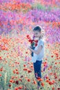 Beautiul girl with big bouquet with poppies