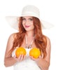 Beautuful woman with red long hair posing in white dress and hat Royalty Free Stock Photo