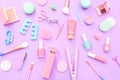 Beauty accessories, facial care set, make-up tools, manicure and pedicure equipment on lilac background, top view