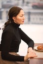 Beauty adult dreaming young woman looking in a window in the coffee house restaurant Royalty Free Stock Photo