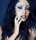 Beauty afro girl with cat make up, creative leopard print closeup halloween