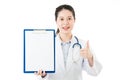 Beauty asian doctor thumbs up showing blank clipboard