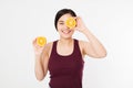 Beauty asian japanese woman hold Oranges.Beauty concept. Beautiful Joyful teen girl with freckles, funny red hairstyle and yellow Royalty Free Stock Photo