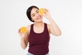 Beauty asian japanese woman hold Oranges.Beauty concept. Beautiful Joyful teen girl with freckles, funny red hairstyle and yellow