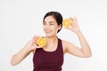 Beauty asian japanese woman hold Oranges.Beauty concept. Beautiful Joyful teen girl with freckles, funny red hairstyle and yellow