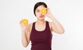 Beauty asian japanese woman hold Oranges.Beauty concept. Beautiful Joyful teen girl with freckles, funny red hairstyle and yellow Royalty Free Stock Photo