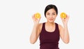 Beauty asian japanese woman hold Oranges.Beauty concept. Beautiful Joyful teen girl with freckles, funny red hairstyle and yellow Royalty Free Stock Photo