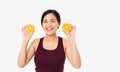 Beauty asian japanese woman hold Oranges.Beauty concept. Beautiful Joyful teen girl with freckles, funny red hairstyle and yellow Royalty Free Stock Photo