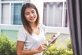 Beauty Asian woman portrait looking camera and using tablet for checking order from customers at home. Business and Delivery