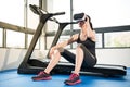 Beauty asian woman rest on treadmill with VR headset Royalty Free Stock Photo