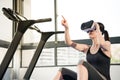 Beauty asian woman rest on treadmill with VR headset Royalty Free Stock Photo