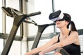 Beauty asian woman rest on treadmill with VR headset Royalty Free Stock Photo