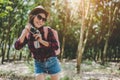 Beauty Asian woman smiling lifestyle portrait of pretty young woman having fun in outdoors summer with digital camera. Traveling Royalty Free Stock Photo