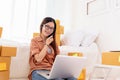 Beauty Asian woman using laptop and calling phone on bed. Business and Technology concept. Delivery and Online shopping concept. Royalty Free Stock Photo